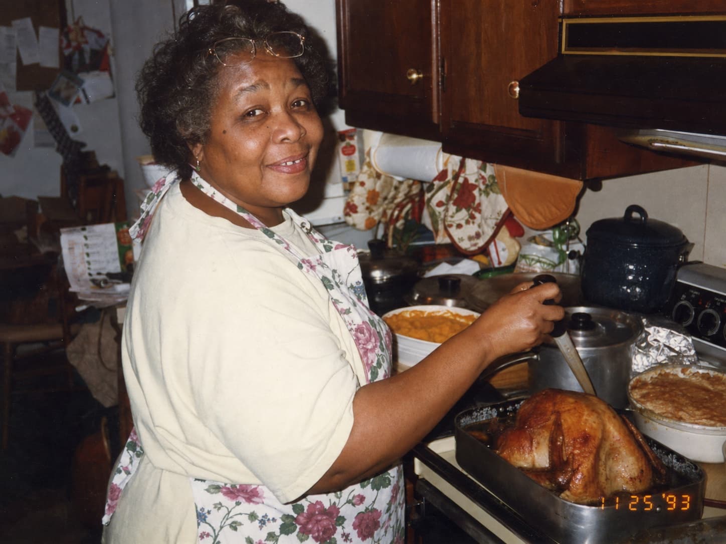 Gloria cooking Sunday dinner at her stove in 1993.